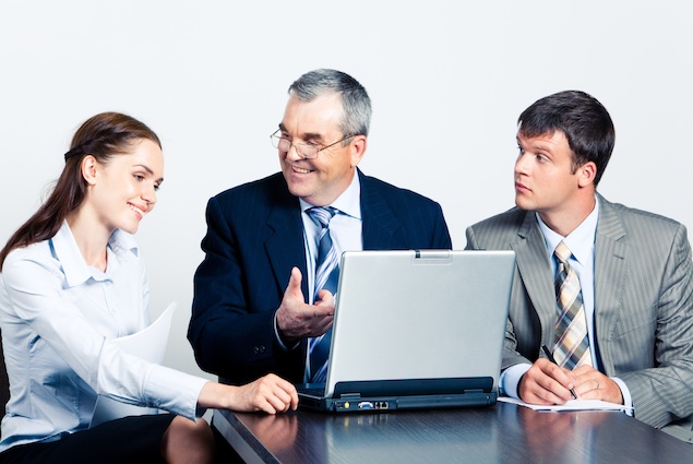 Communication of elderly boss with his managers