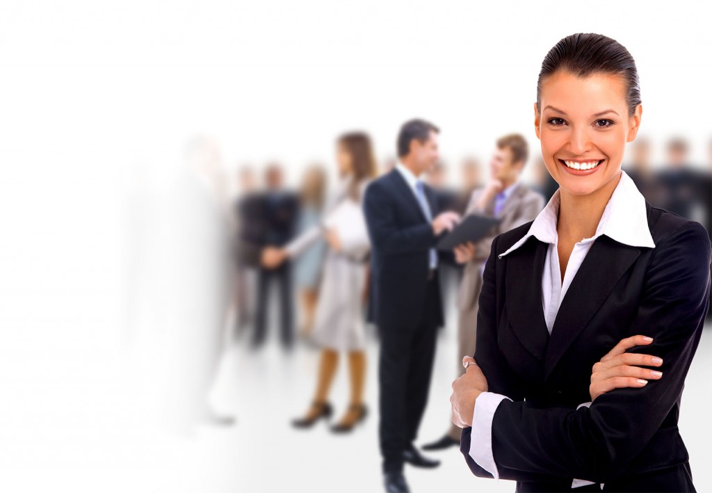 Female Business leader standing in front of her team